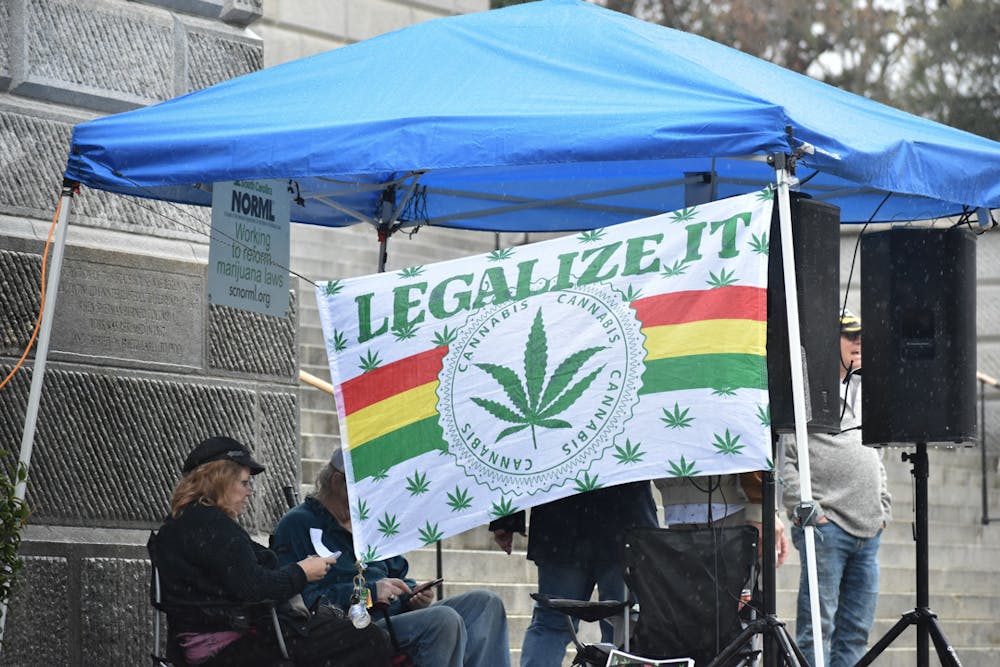 <p>The NORML organization set up in front of the Statehouse during a protest for the decriminalization of marijuana. They played parodies of well-known songs to support their cause during the event on Feb. 17, 2023.</p>