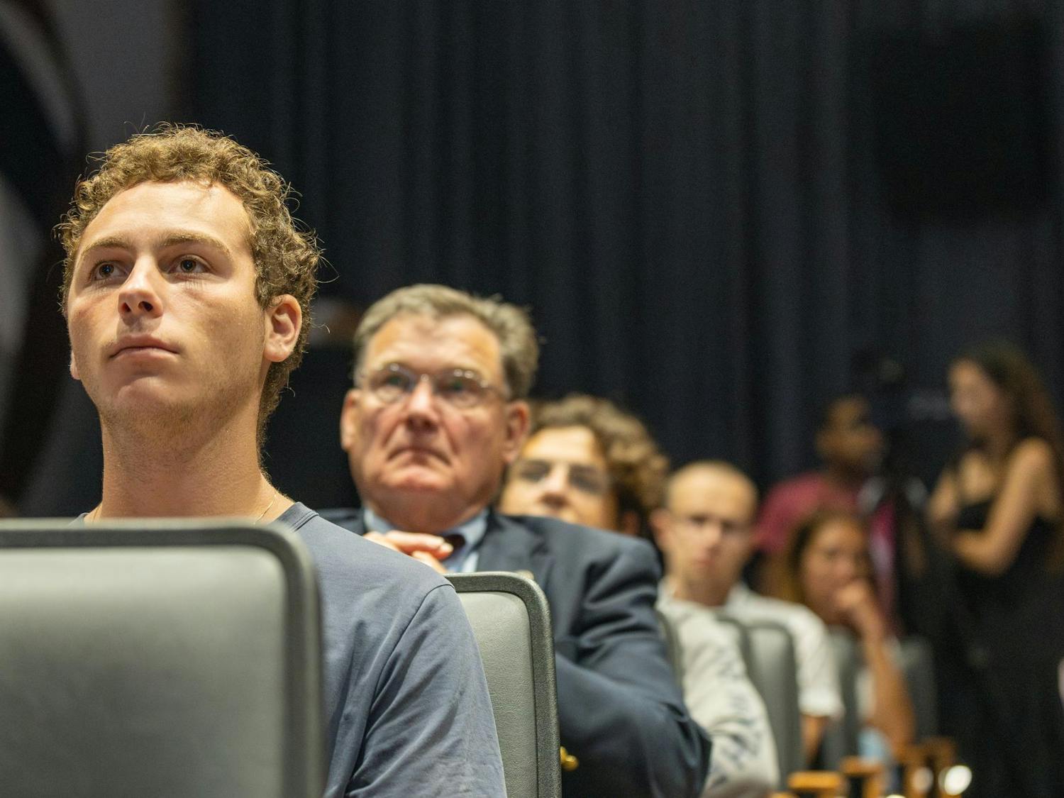 Third-year sport and entertainment management student Ethan Turkel (left) at the Israel Solidarity Rally, hosted by Gamecocks for Israel, listens to speakers recount their experiences as Jewish Americans since Oct. 7, 2023 in Russell House. The event commemorated one year since Oct. 7, 2023 with various speakers, religious leaders and politicians on the program.