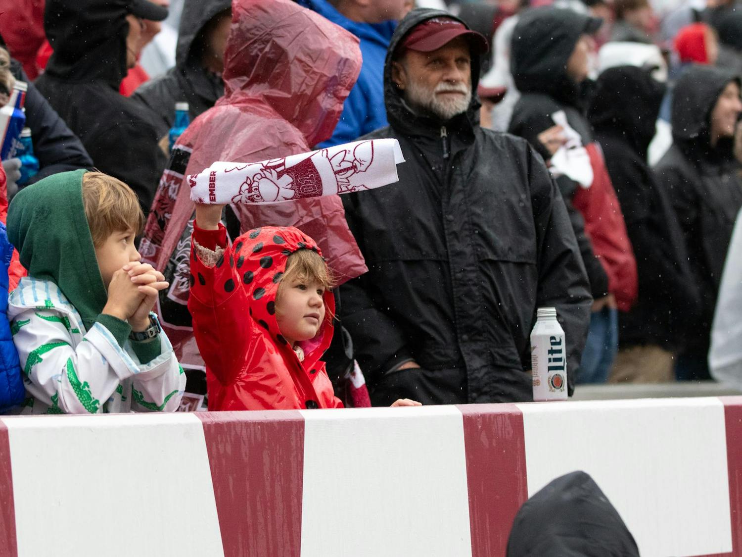 A young Gamecock fan waves her rally towel at Williams-Brice Stadium on Nov. 11, 2023. Fans gathered in the rainy, 50-degree weather to watch the Gamecocks play the Commodores.