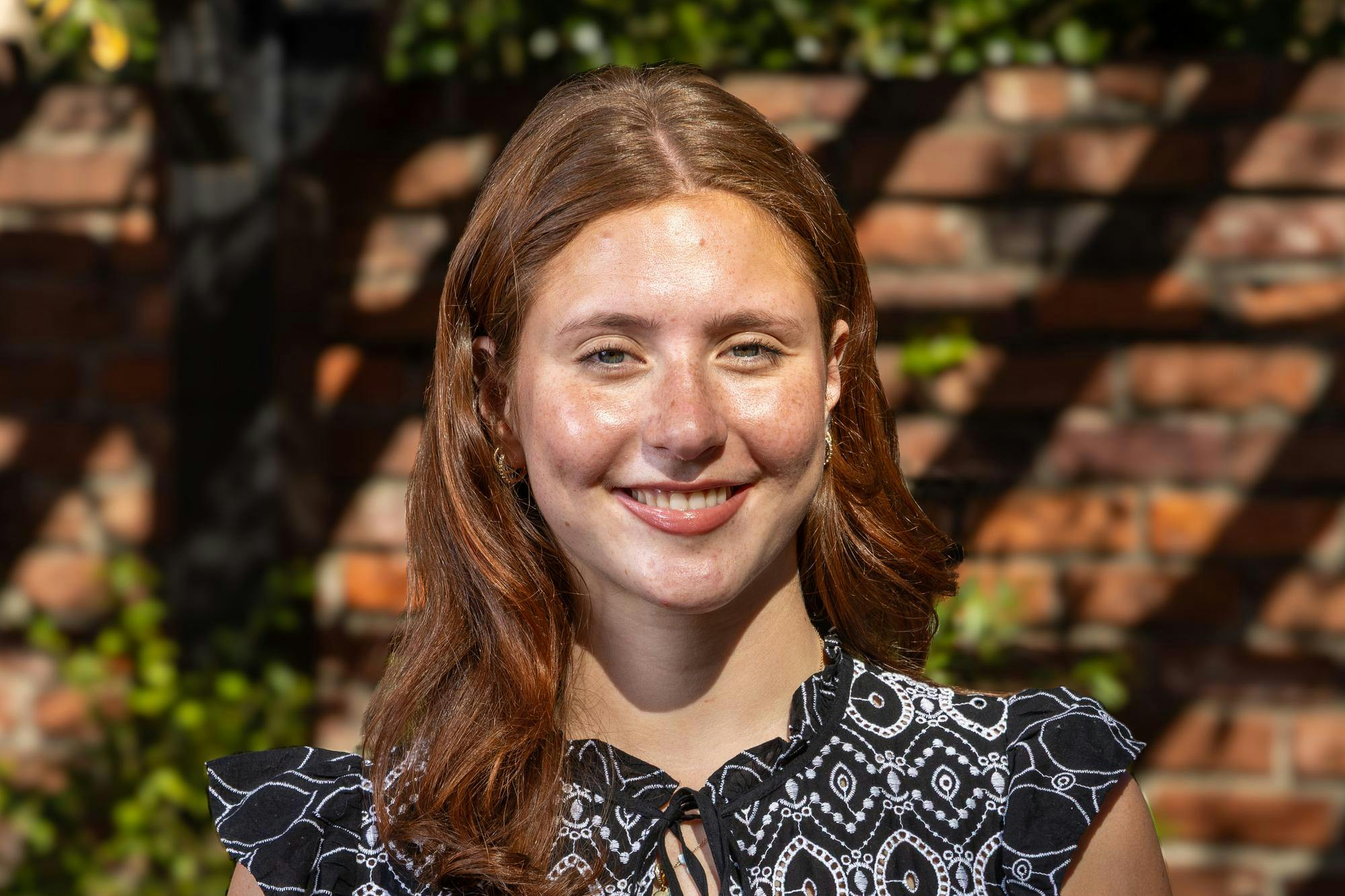 Third-year sport and entertainment management student Kiki D’Apolito poses for a portrait outside the Kennedy Greenhouse on Feb. 17, 2026. D'Apolito will be the next speaker of the student senate for the 2026-27 school year.