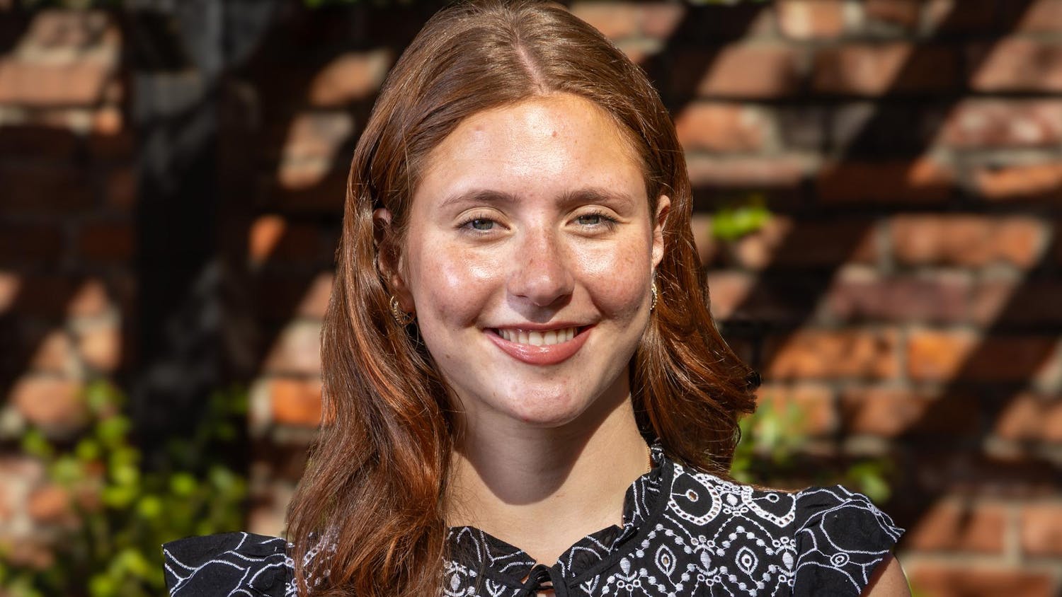Third-year sport and entertainment management student Kiki D’Apolito poses for a portrait outside the Kennedy Greenhouse on Feb. 17, 2026. D'Apolito will be the next speaker of the student senate for the 2026-27 school year.