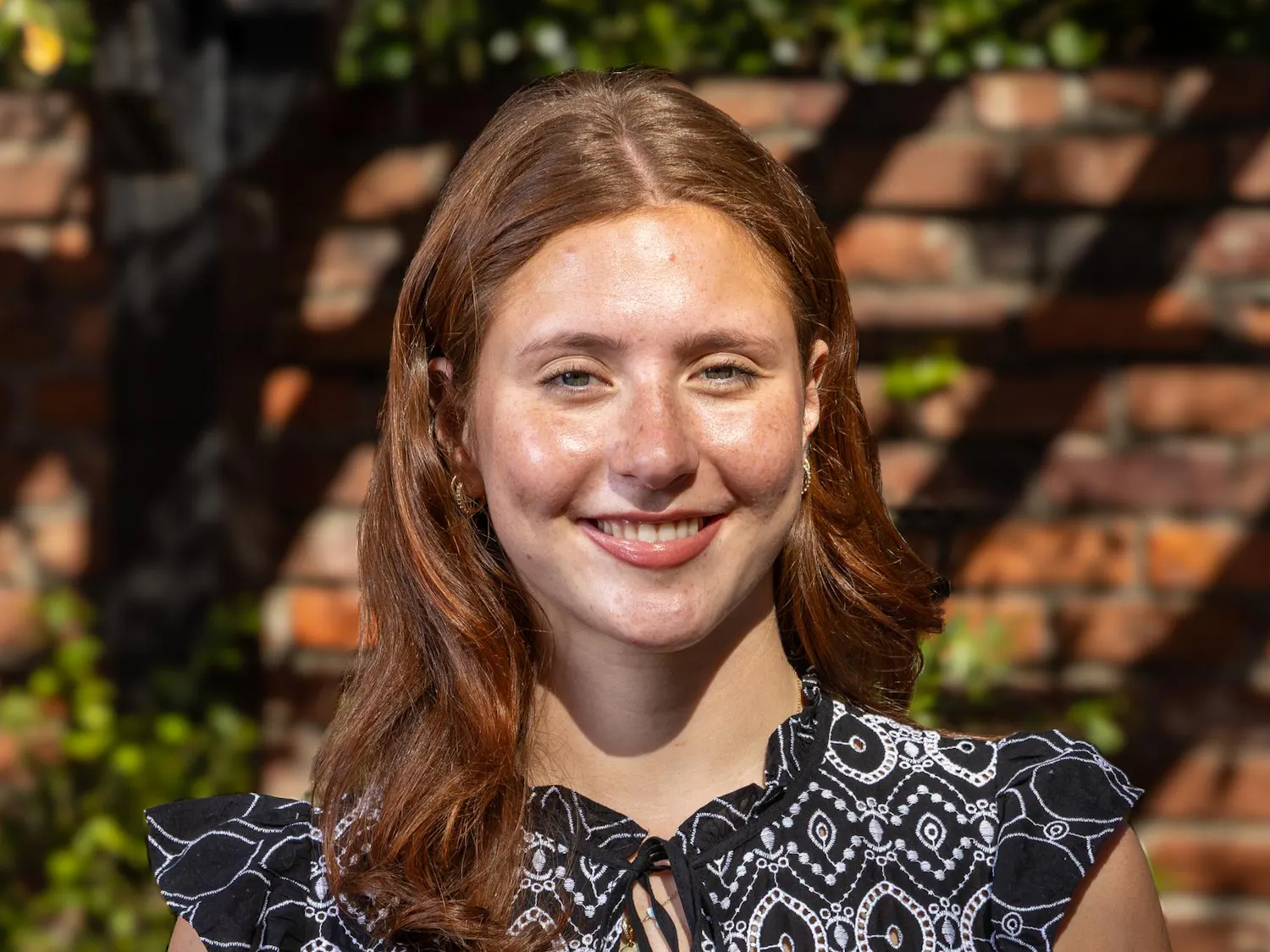 Third-year sport and entertainment management student Kiki D’Apolito poses for a portrait outside the Kennedy Greenhouse on Feb. 17, 2026. D'Apolito will be the next speaker of the student senate for the 2026-27 school year.