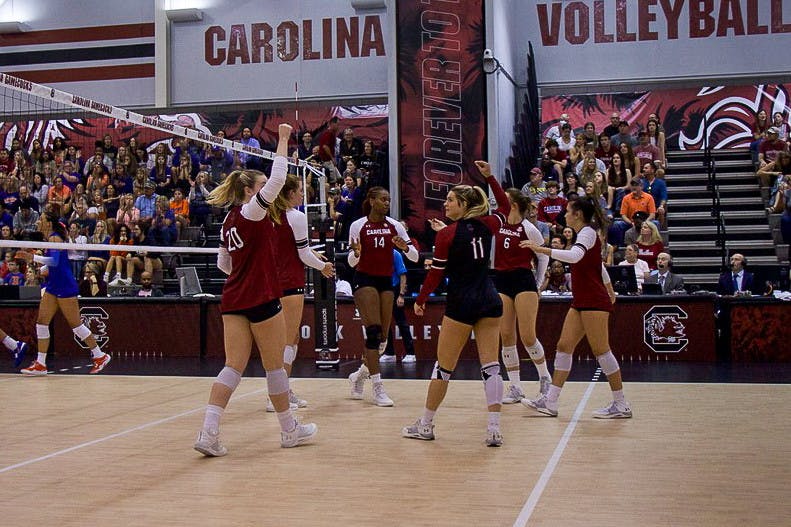 Gamecocks celebrate in unity on the court after gaining a point against the Florida Gators on Sept. 24, 2022. 