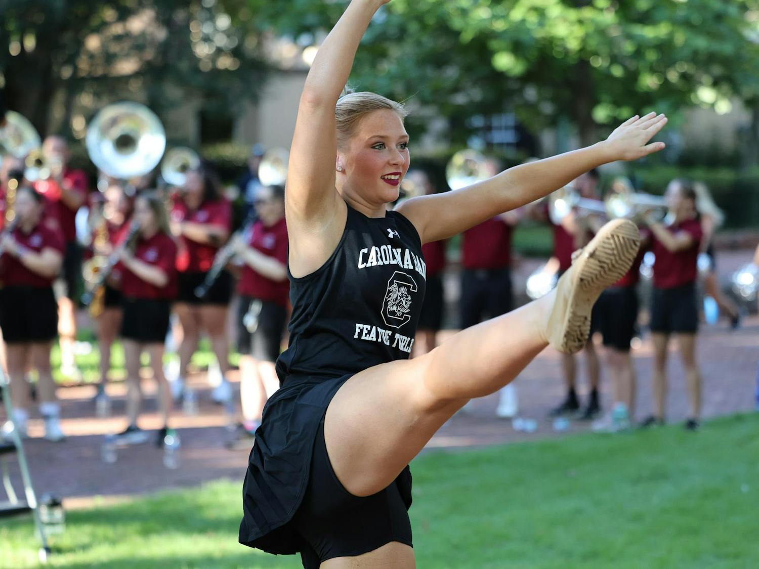 A Feature Twirler performs with the Carolina Band on the Horseshoe on Aug. 19, 2024. The band performed as part of the First Night Carolina event, welcoming students back to campus.