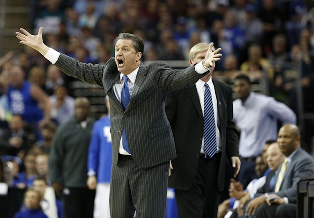 Kentucky head coach John Calipari questions a call in the second half against Notre Dame in the NCAA Tournament&apos;s Elite 8 on Saturday, March 28, 2015, at Quicken Loans Arena in Cleveland. Kentucky advanced, 68-66. (Charles Bertram/Lexington Herald-Leader/TNS)