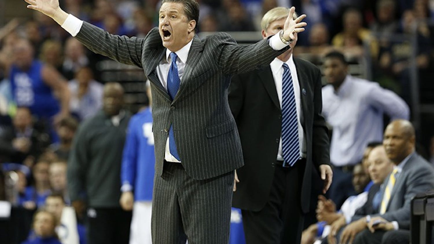 Kentucky head coach John Calipari questions a call in the second half against Notre Dame in the NCAA Tournament&apos;s Elite 8 on Saturday, March 28, 2015, at Quicken Loans Arena in Cleveland. Kentucky advanced, 68-66. (Charles Bertram/Lexington Herald-Leader/TNS)