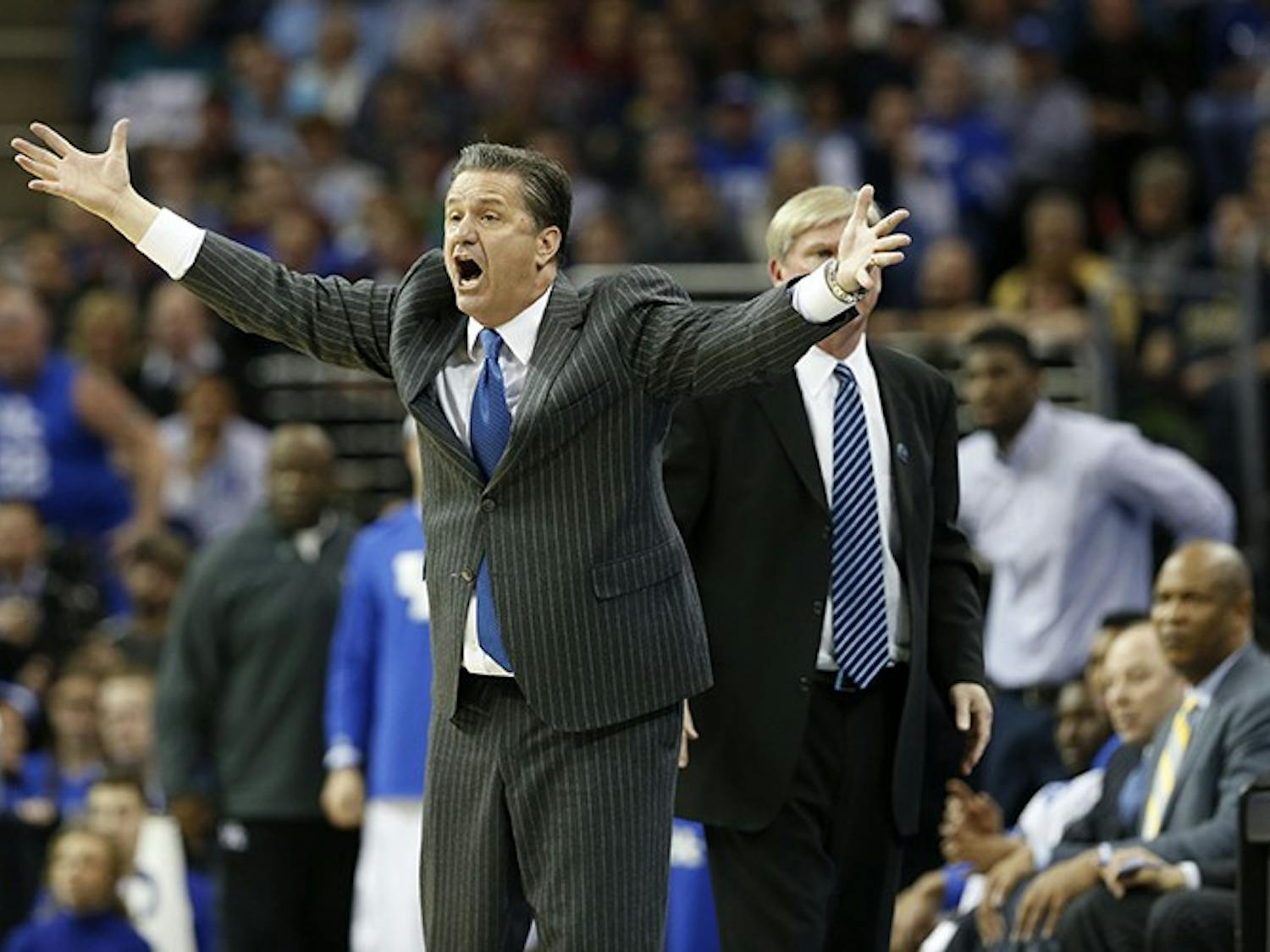 Kentucky head coach John Calipari questions a call in the second half against Notre Dame in the NCAA Tournament's Elite 8 on Saturday, March 28, 2015, at Quicken Loans Arena in Cleveland. Kentucky advanced, 68-66. (Charles Bertram/Lexington Herald-Leader/TNS)