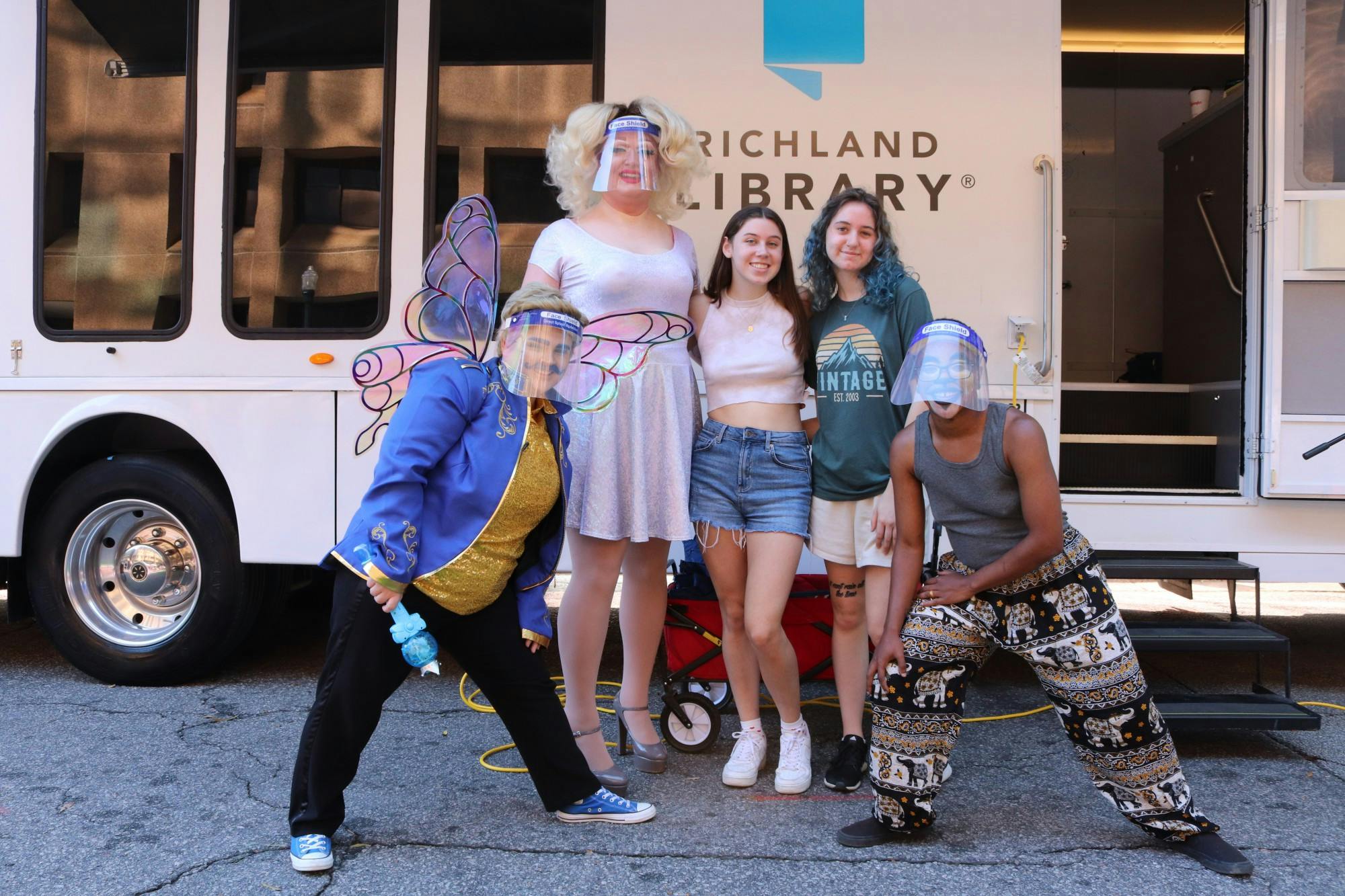Drag queen Onya Nerves, drag kings Dandy and Marty McGuy, and USC freshmen Alexa Poupis and Sarah Sham pose for a photo after D.R.A.G. Storytime at the 2021 South Carolina Pride Festival, an event dedicated to celebrating the LGBTQIA+ community and advocating for LGBQIA+ equality.