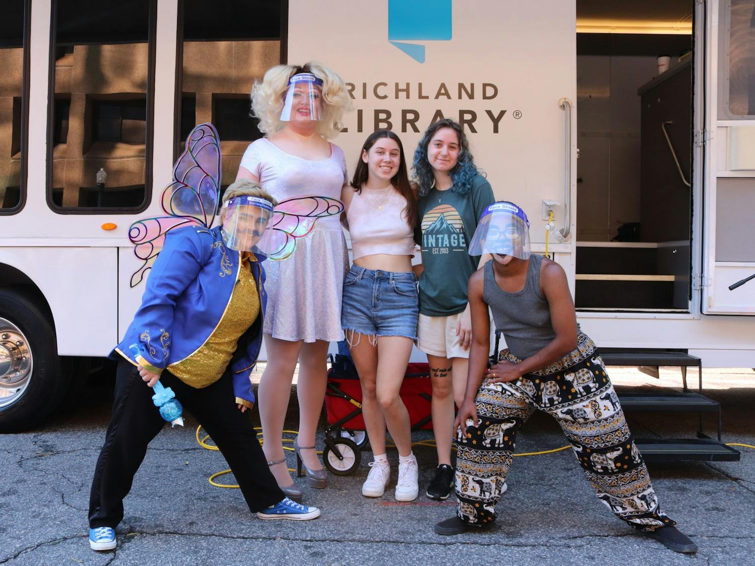 Drag queen Onya Nerves, drag kings Dandy and Marty McGuy, and USC freshmen Alexa Poupis and Sarah Sham pose for a photo after D.R.A.G. Storytime at the 2021 South Carolina Pride Festival, an event dedicated to celebrating the LGBTQIA+ community and advocating for LGBQIA+ equality.
