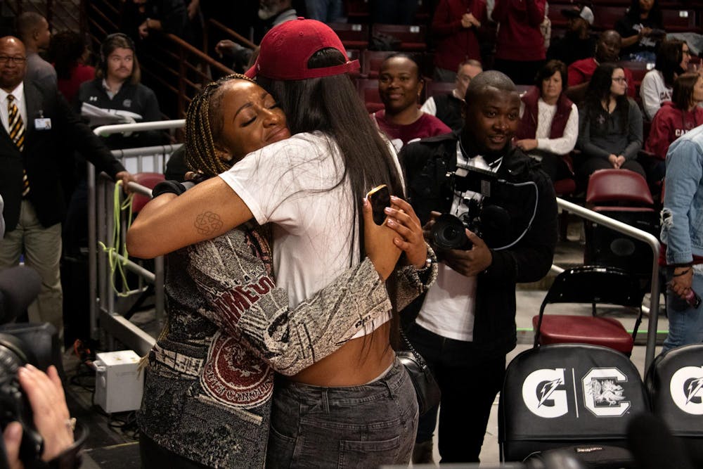 <p>WNBA champion and former Gamecock A'ja Wilson hugs Tiffany Mitchell at Mitchell's jersey retirement ceremony on Nov. 12, 2023. Mitchell's jersey is now hung up in the rafters of Colonial Life Arena.</p>