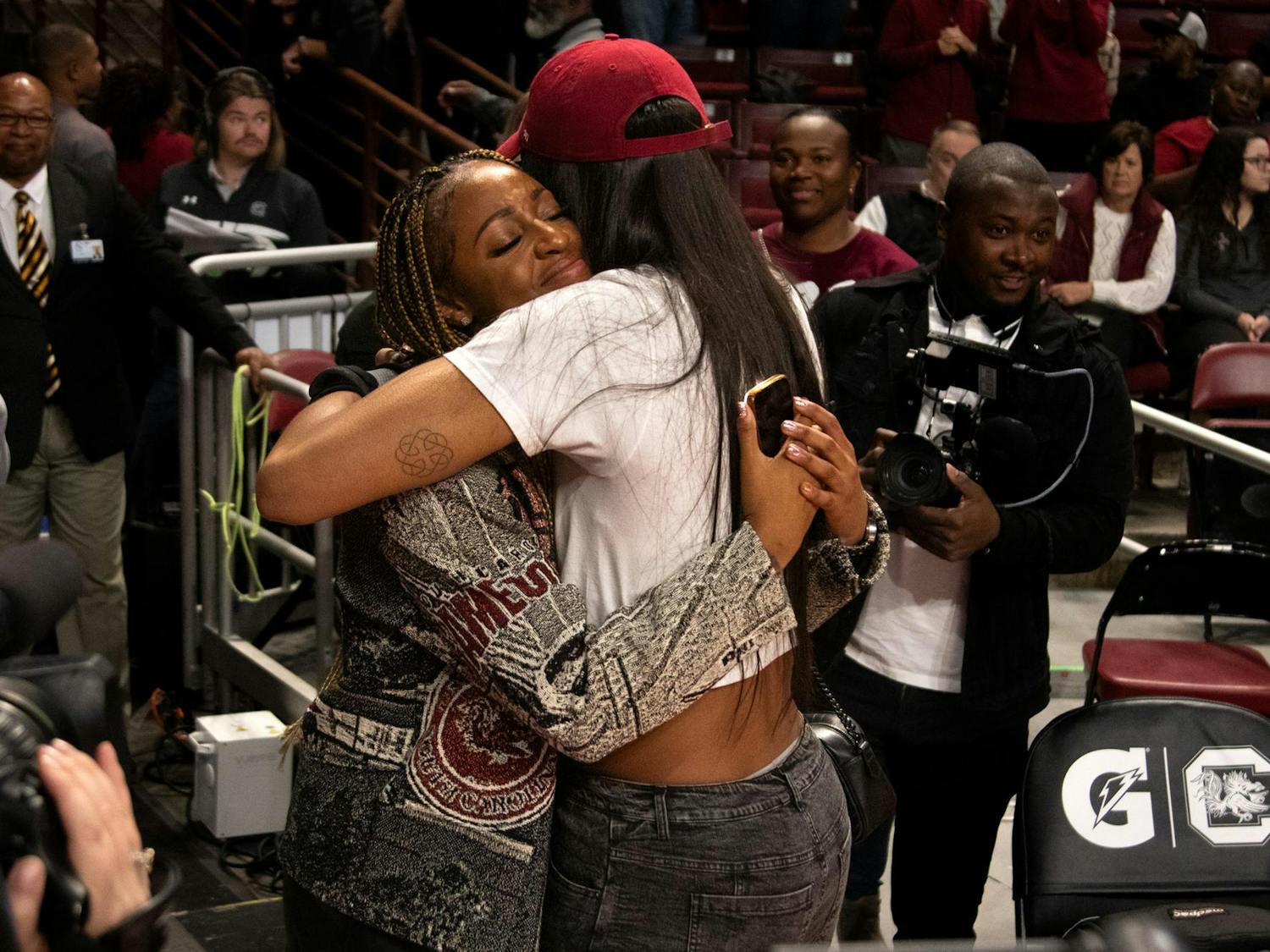 WNBA champion and former Gamecock A'ja Wilson hugs Tiffany Mitchell at Mitchell's jersey retirement ceremony on Nov. 12, 2023. Mitchell's jersey is now hung up in the rafters of Colonial Life Arena.