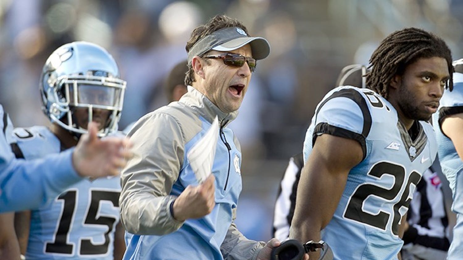 UNC head coach Larry Fedora reacts after N.C. State&apos;s Juston Burris (10) intercepted a Marquise Williams pass late in the second quarter on Saturday, Nov. 29, 2014 at Kenan Stadium in Chapel Hill, N.C. N.C. State won 25-7. (Robert Willett/Raleigh News &amp; Observer/TNS) 