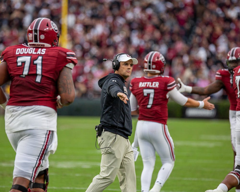 <p>FILE— South Carolina head football coach Shane Beamer congratulates players after redshirt junior Spencer Rattler scored South Carolina's first touchdown of the game on Oct. 29, 2022, in a game against Missouri.&nbsp;</p>