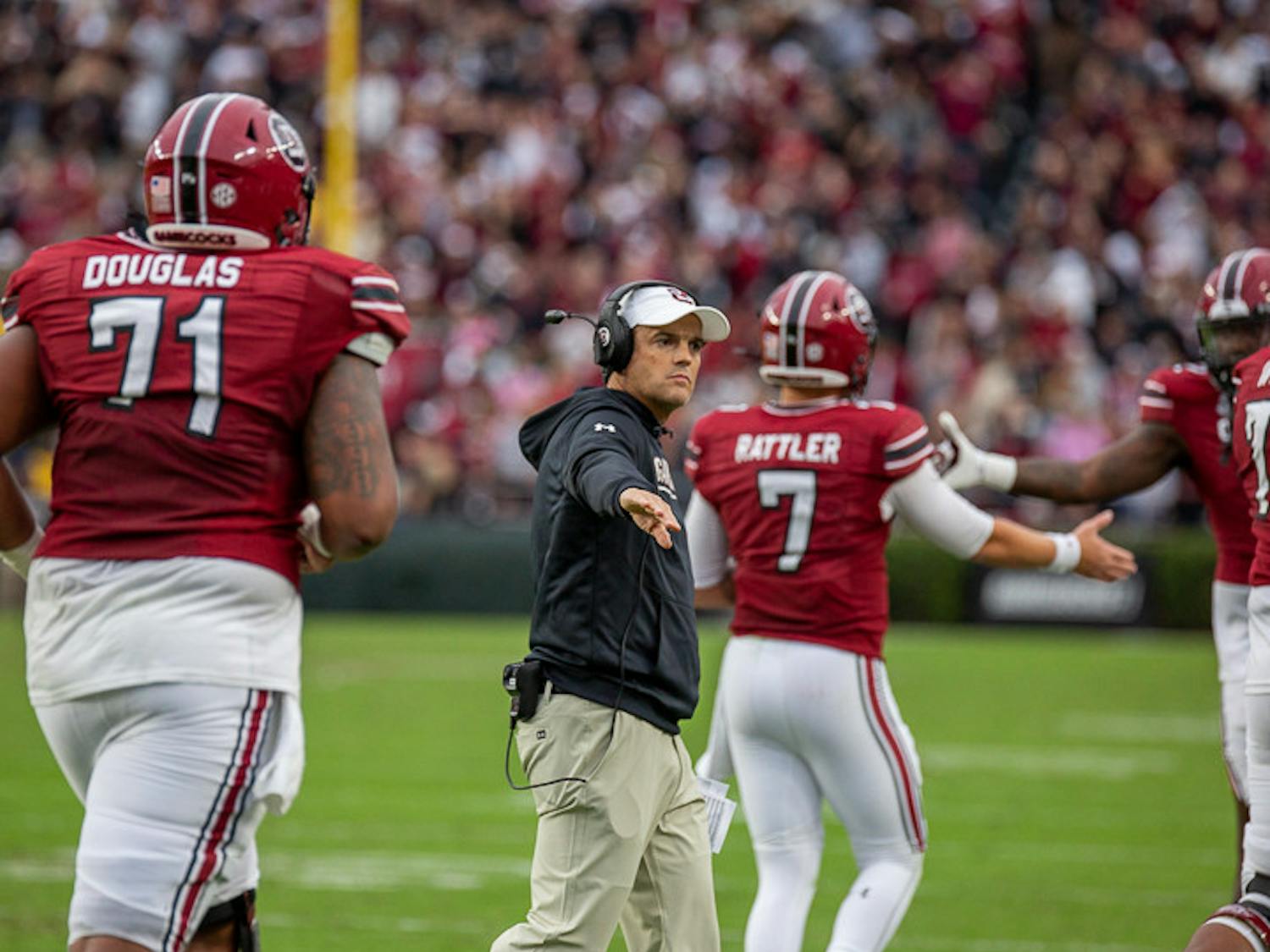 FILE— South Carolina head football coach Shane Beamer congratulates players after redshirt junior Spencer Rattler scored South Carolina's first touchdown of the game on Oct. 29, 2022, in a game against Missouri. 