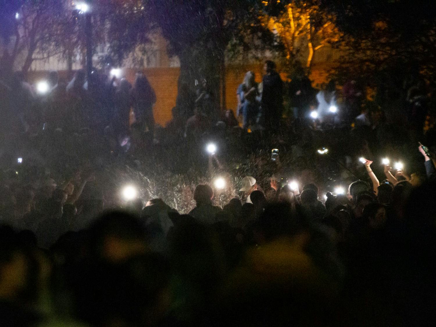 Students at the University of South Carolina storm the fountain at Thomas Cooper Library on April 3, 2022 in Columbia, SC. The celebration came shortly after the women's basketball team defeated UConn in the NCAA championship.&nbsp;