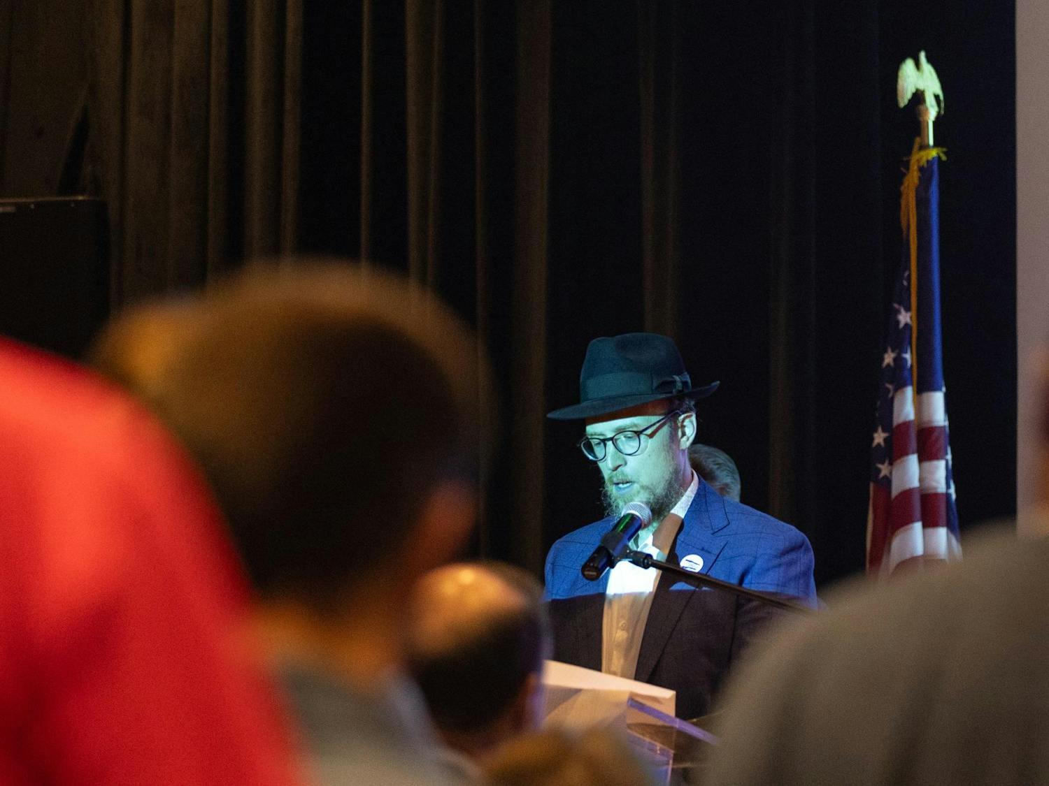 Rabbi Sruly leads attendees of the Israel Solidarity Rally, hosted by Gamecocks for Israel, in prayer to open the event on Oct. 7, 2024. Sruly is the director of Rohr Chabad at the University of South Carolina.