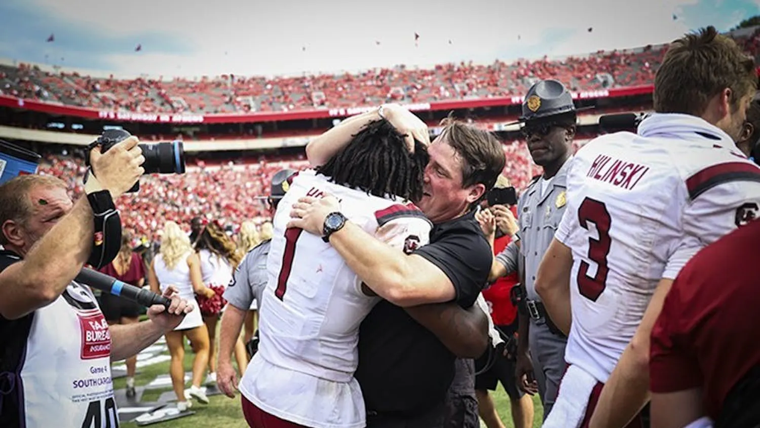FILE—Former members of the South Carolina football team gather with former head coach Will Muschamp following a victory over Georgia on Oct. 12, 2019 in Athens, GA. This was the first time the Gamecocks beat the Bulldogs since 2014.