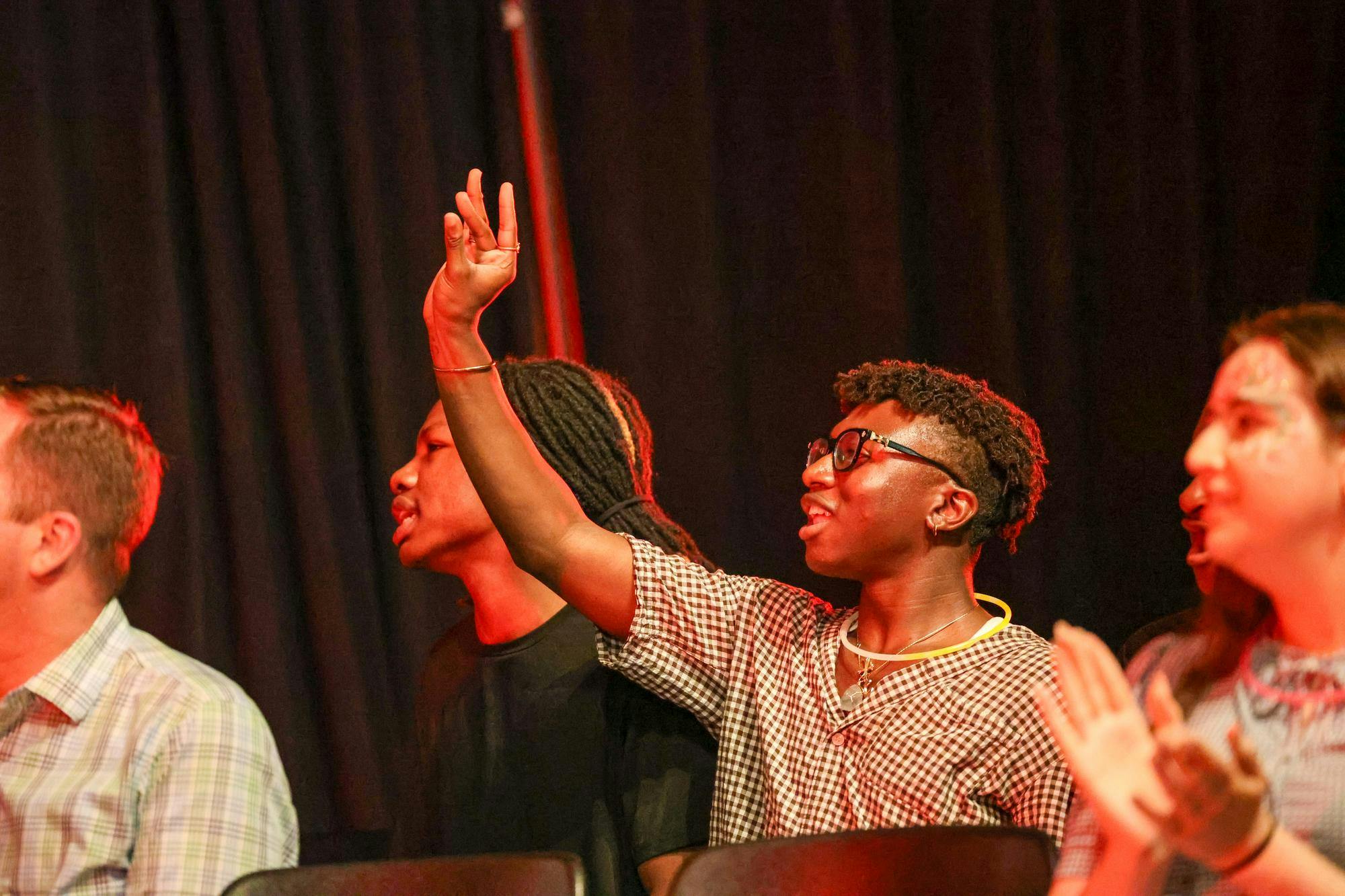 Audience members at Birdcage cheer for the drag performers in the Russell House Ballroom on April 14, 2026. The event was free for anyone to attend.