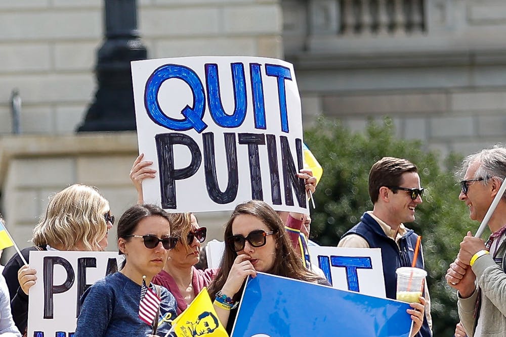 <p>A protestor holds a sign during the Stand with Ukraine Rally and March at the South Carolina Statehouse on April 2, 2022. The rally was held as a response to Russia's invasion of Ukraine.</p>