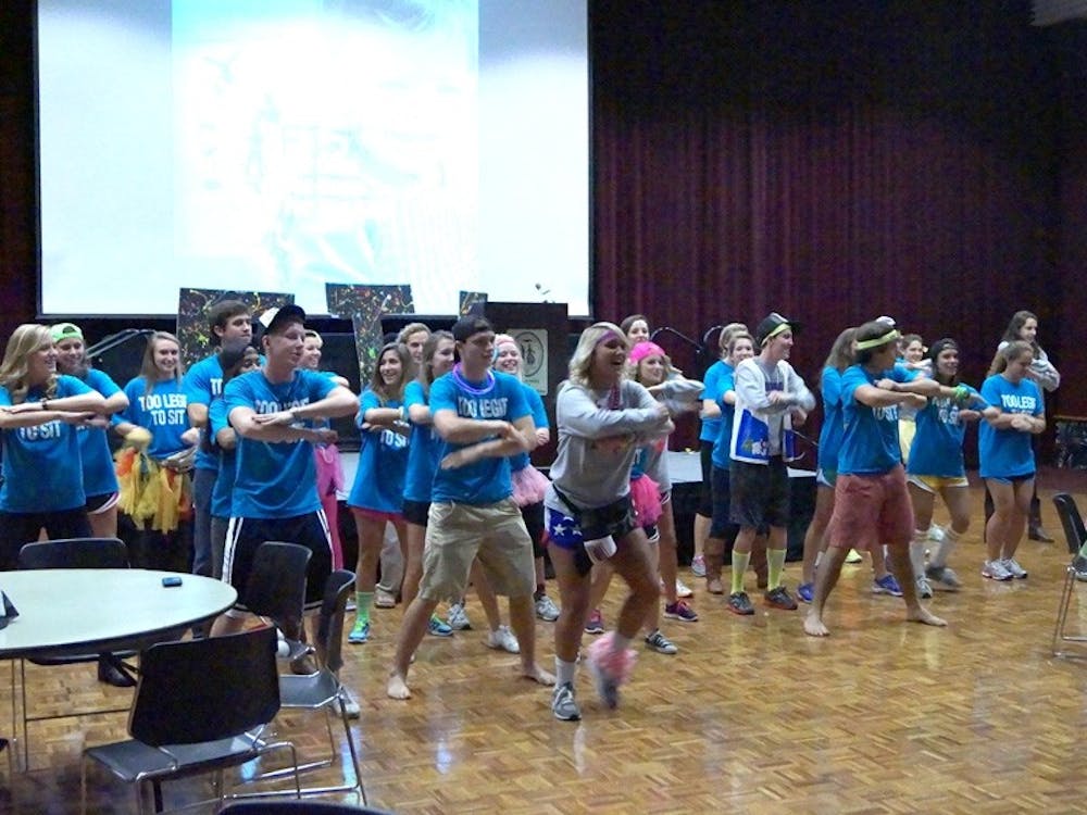 Donning “Too Legit to Sit” T-shirts, Dance Marathon organizers show how to do one of the dances they will teach at the 24-hour event.