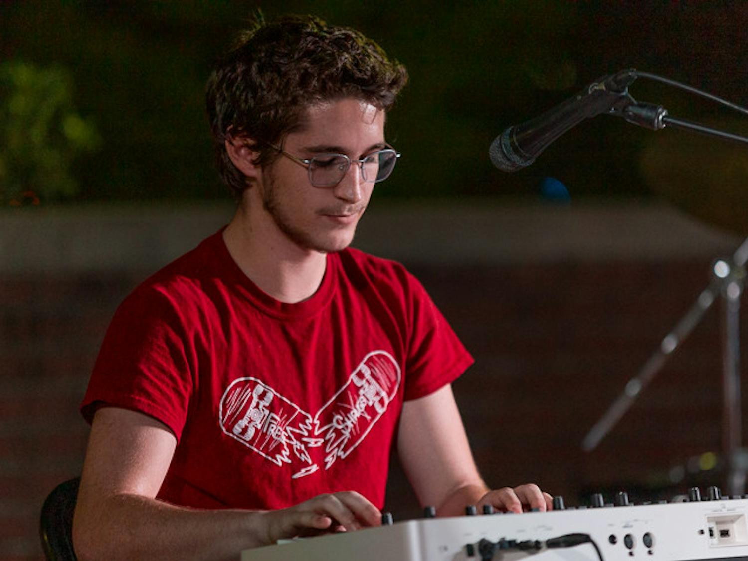 Second-year computer science student Wyatt Carhart plays the keyboard during Henry and the Sleepers' performance at the Battle of the Bands on Oct. 5, 2022. The competition brought acappella, folk, rap and rock to the Russel House Patio in a variety of performances.