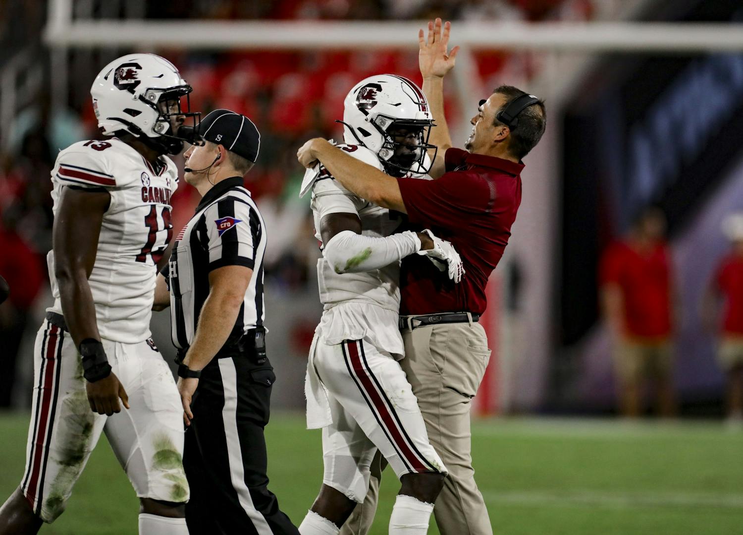 Head coach Shane Beamer celebrates a defensive stop by redshirt freshman defensive back O'Donnell Fortune in South Carolina's game against Georgia on Sept. 18, 2021.