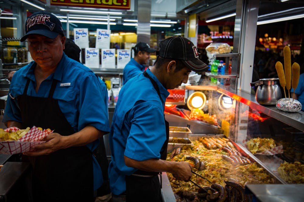 &nbsp;Workers at the South Carolina State Fair prepare food. The fair will be drive-thru only this year.