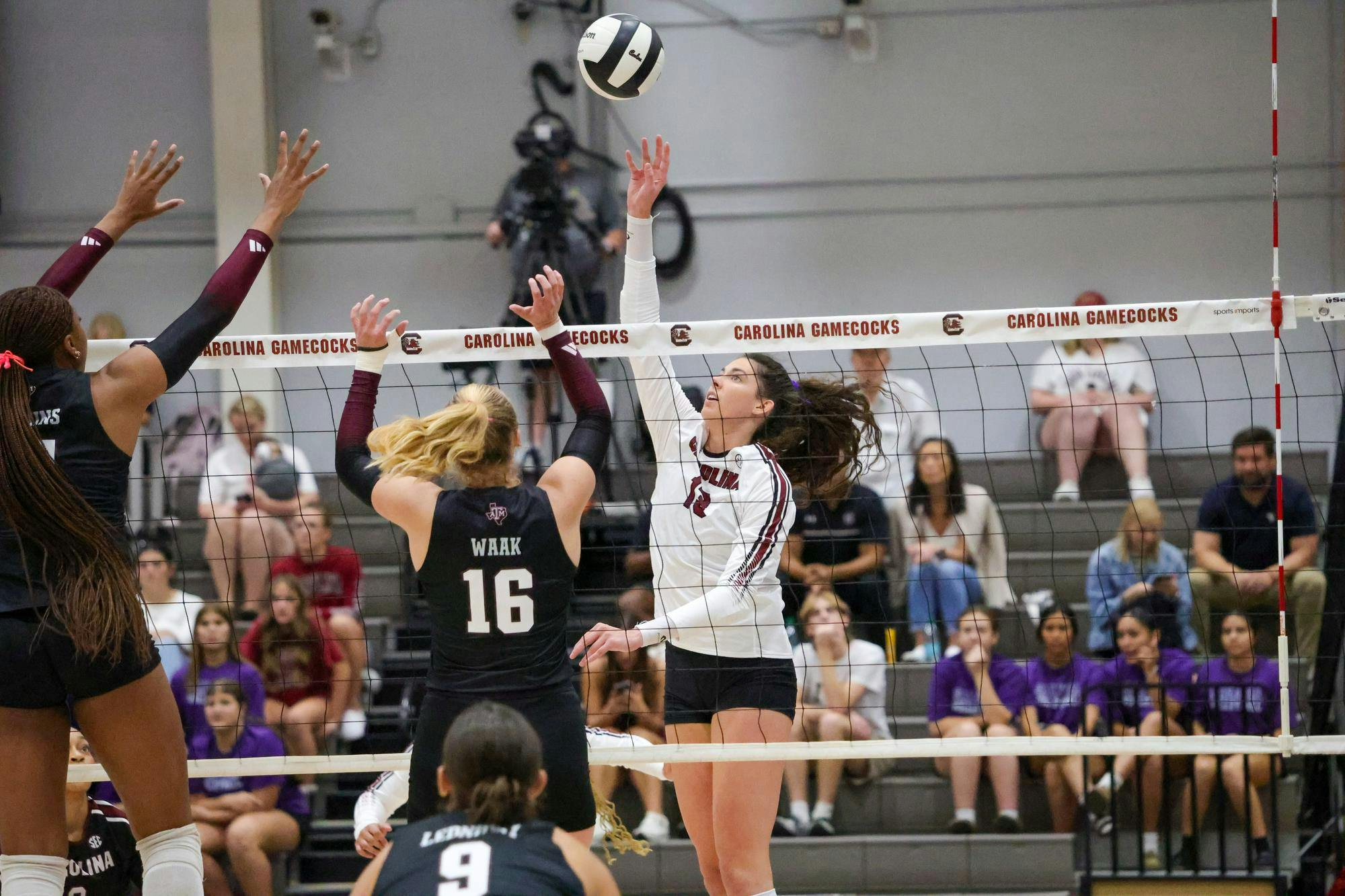 Senior outside hitter Alayna Johnson rises for an attack during South Carolina’s match against Texas A&amp;M at the Carolina Volleyball Center on Wednesday, Oct. 1, 2025. Johnson challenges the block as the Gamecocks push to keep momentum in the rally.