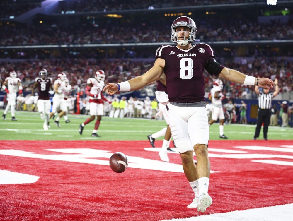 Texas A&M quarterback Trevor Knight (8) celebrates a touchdown against Arkansas in the second quarter at AT&T Stadium in Arlington, Texas, on Saturday, Sept. 24, 2016. (Richard W. Rodriguez/Fort Worth Star-Telegram/TNS)