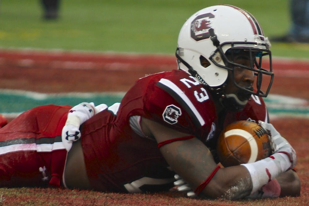 	Junior wide receiver Bruce Ellington clutches one of his two touchdowns on the day, propelling South Carolina to a 34-24 victory over Wisconsin in the 2014 Capital One Bowl.