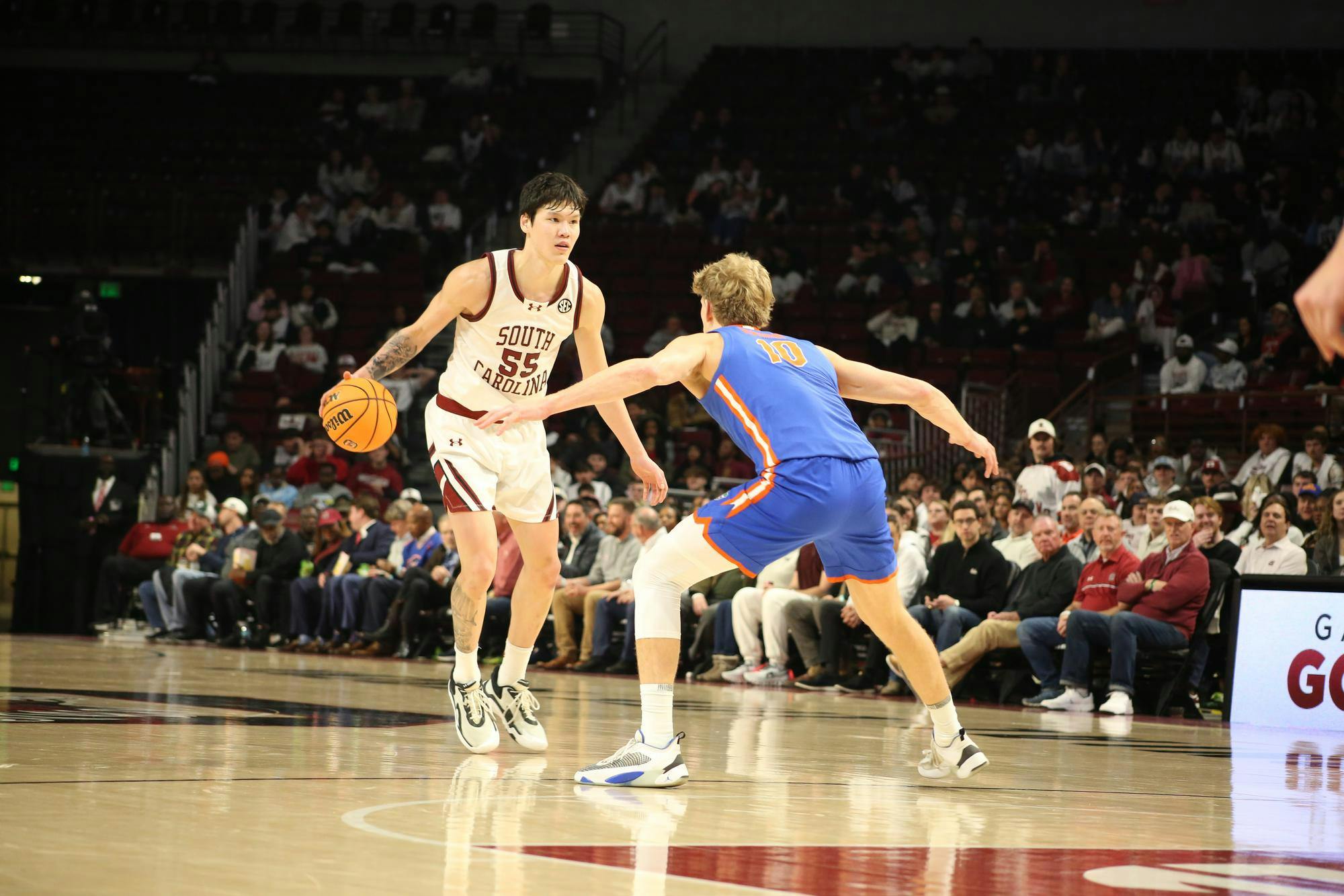 FILE — Senior guard Mike Sharavjamts dribbles the ball towards a Gator player on Jan. 28, 2026, at Colonial Life Arena. The Gamecocks lost 95-48 against the Gators.