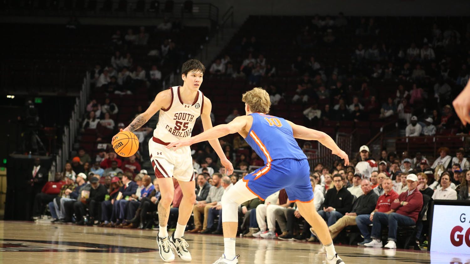 FILE — Senior guard Mike Sharavjamts dribbles the ball towards a Gator player on Jan. 28, 2026, at Colonial Life Arena. The Gamecocks lost 95-48 against the Gators.