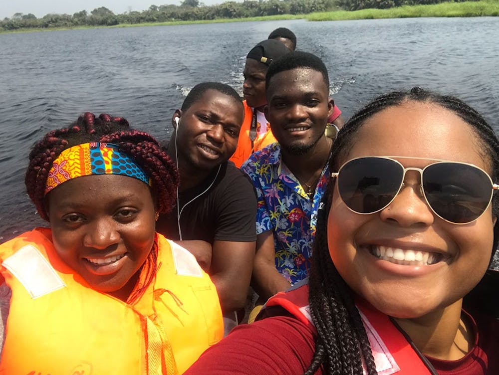 <p>Black and Abroad Gamecocks co-president Michaela Catoe and University of Ghana students travel to the village of Nzulezu by canoe.</p>