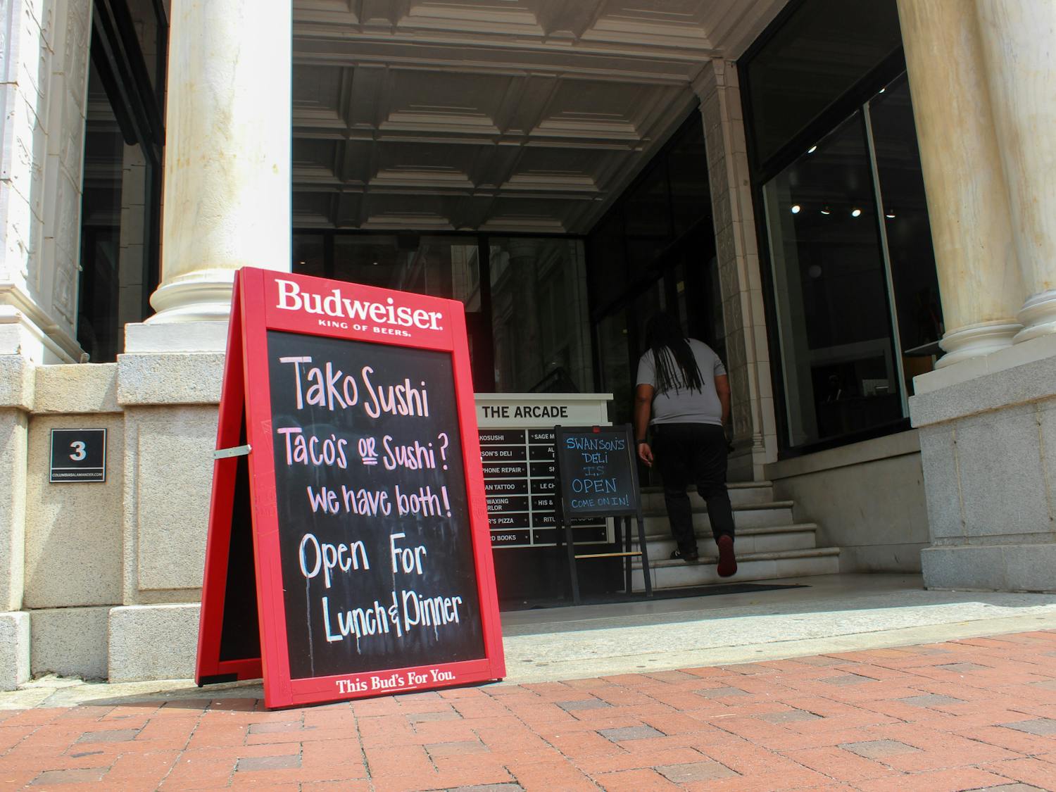 A photo of a sign at the front of TakoSushi on Aug. 18, 2022. After a three-year hiatus, TakoSushi re-opened in late July on Main Street.