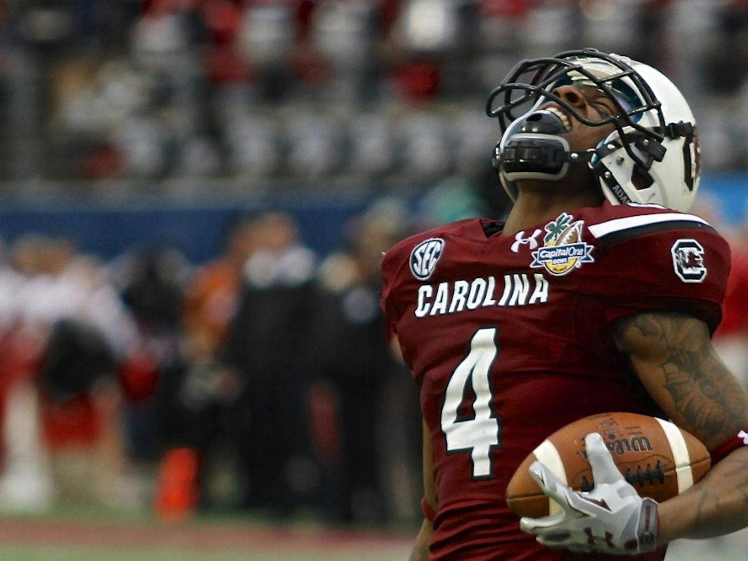 	Sophomore wide receiver Shaq Roland celebrates one of his six catches for 112 yards in the Gamecocks&#8217; 34-24 win over Wisconsin in the 2014 Capital One Bowl.