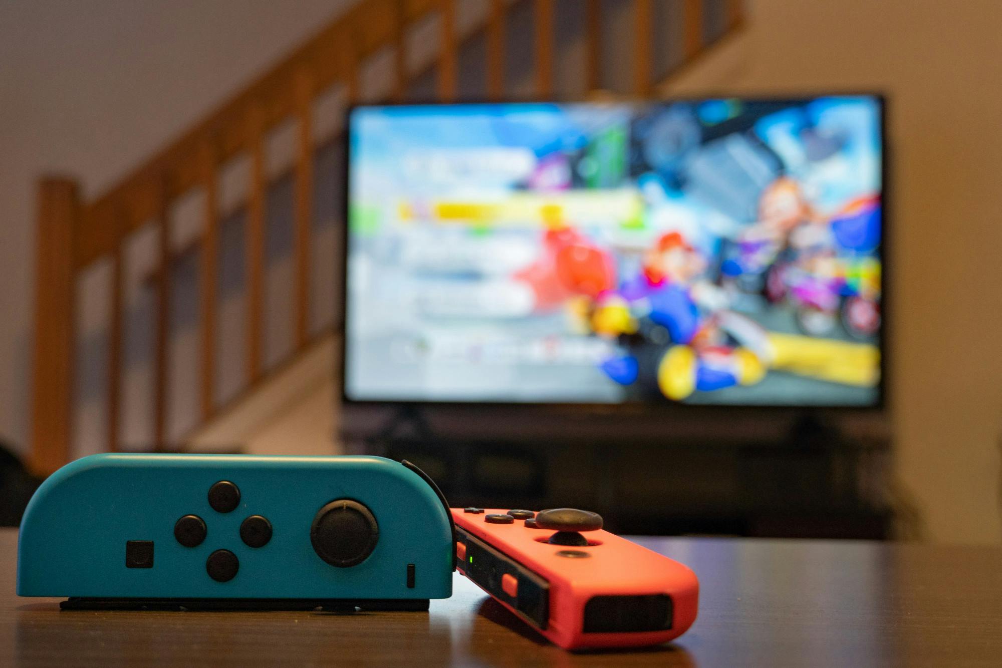 PHOTO ILLUSTRATION— Two Nintendo joy cons sit on a table before a game of Mario Kart on August 28, 2022.