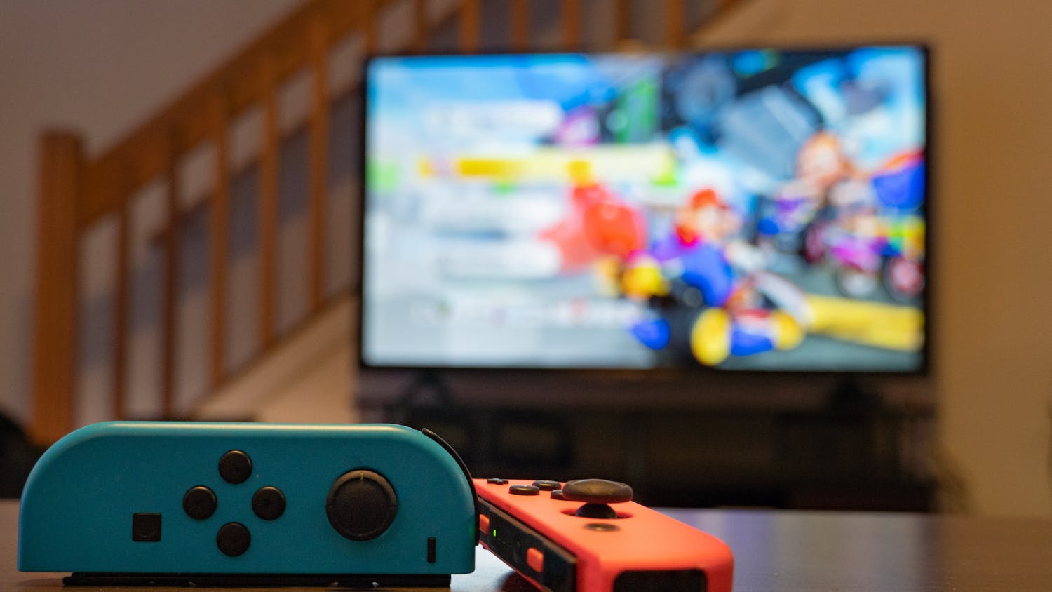 PHOTO ILLUSTRATION— Two Nintendo joy cons sit on a table before a game of Mario Kart on August 28, 2022.