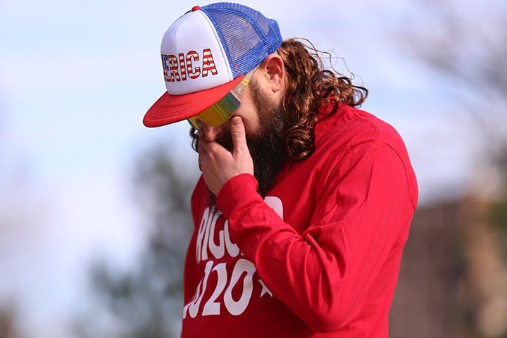 A speaker at the “Drive4America” rally wipes away tears as he shares stories of his friends who passed in the military. “Drive4America” was widely made up of veterans.&nbsp;
