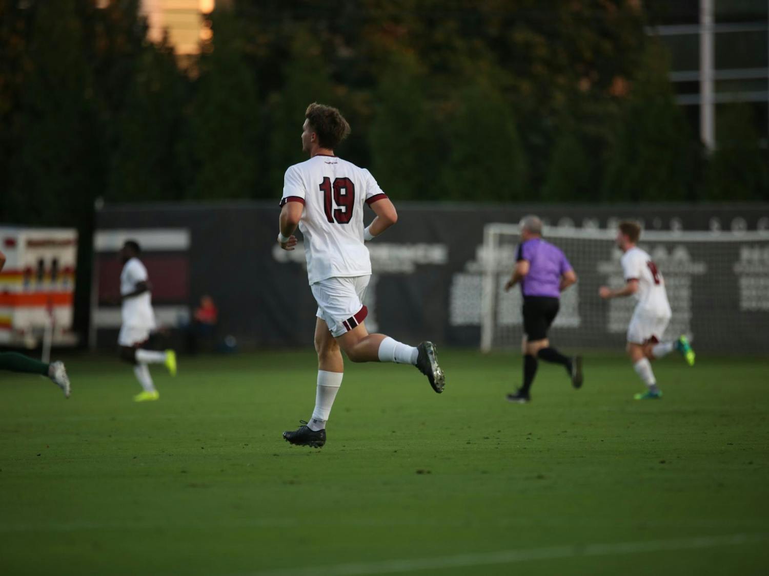 Fifth-year forward Martin Yahia runs toward the play after passing the ball to a teammate on Oct. 3, 2023. The Gamecocks beat the Dolphins 1-0.