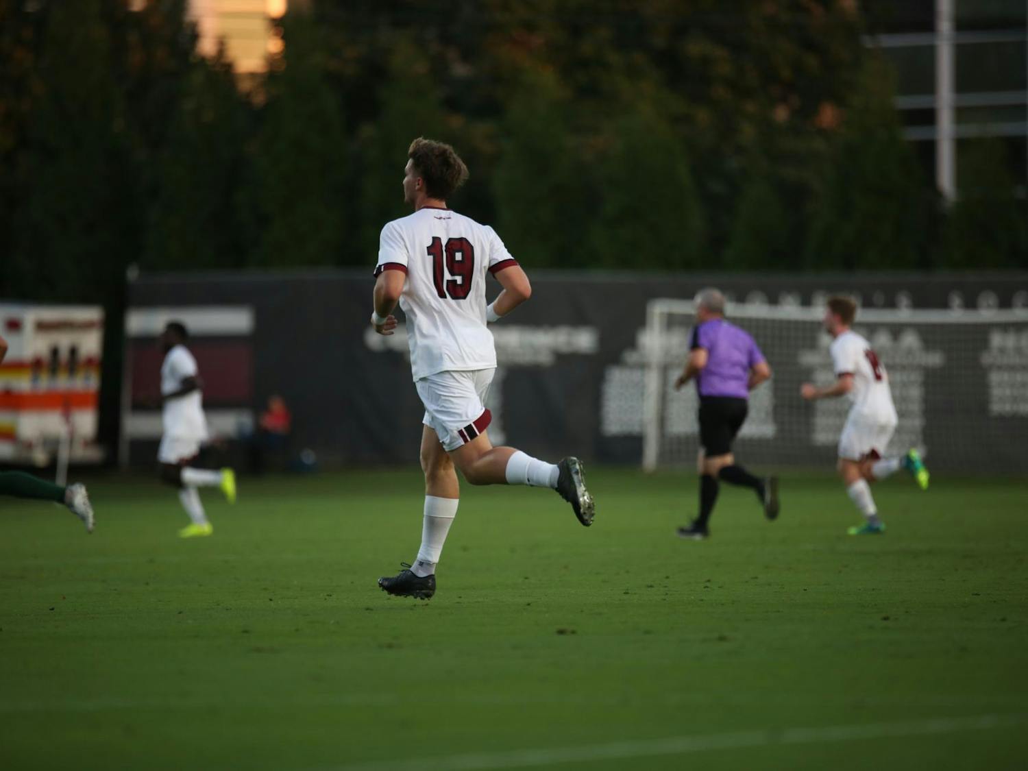 Fifth-year forward Martin Yahia runs toward the play after passing the ball to a teammate on Oct. 3, 2023. The Gamecocks beat the Dolphins 1-0. 