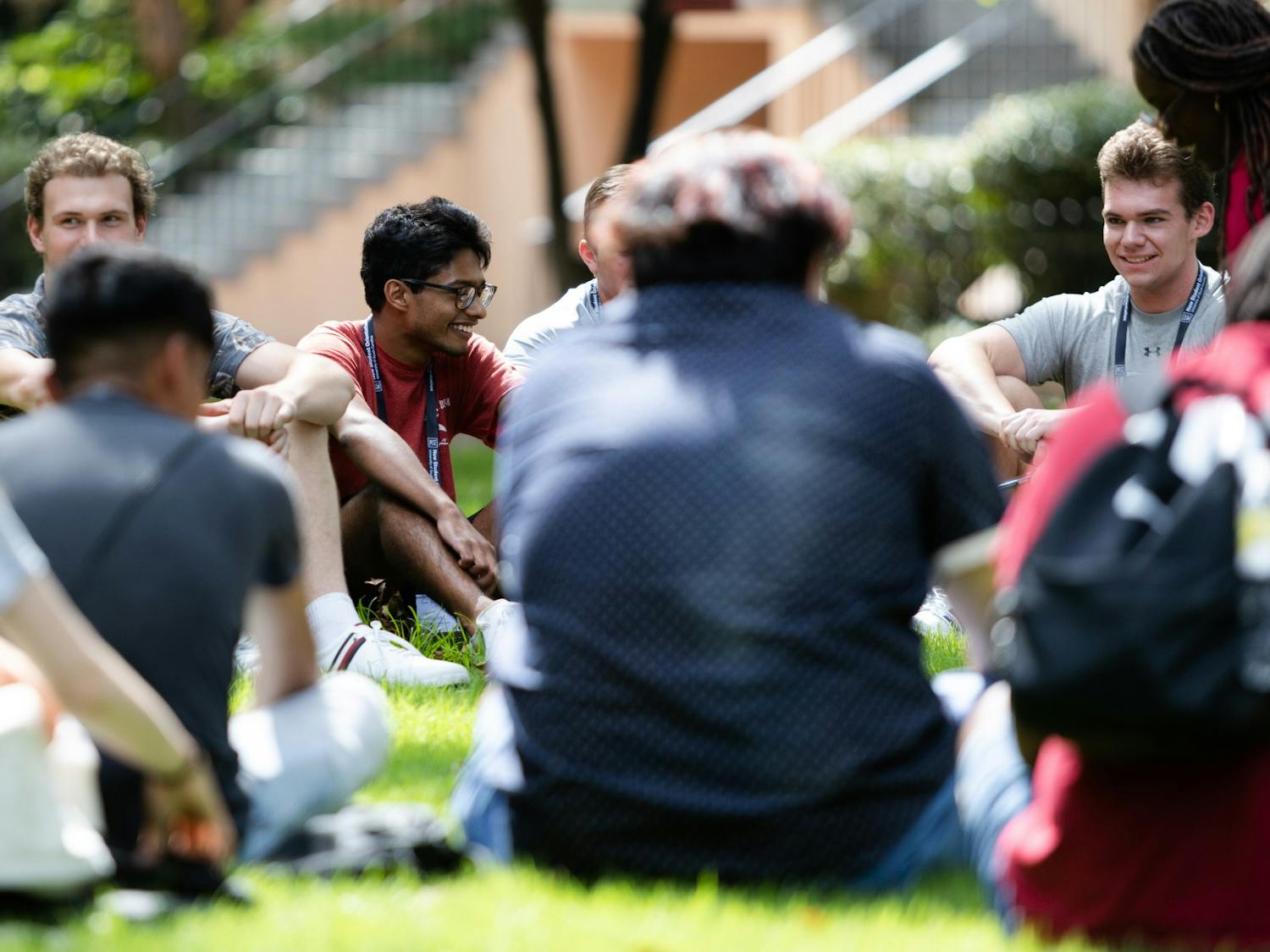 An incoming student laughs with people in his orientation group during a session on July 20, 2022. Students listened to presentations, toured campus and played games during orientation sessions held throughout the summer.