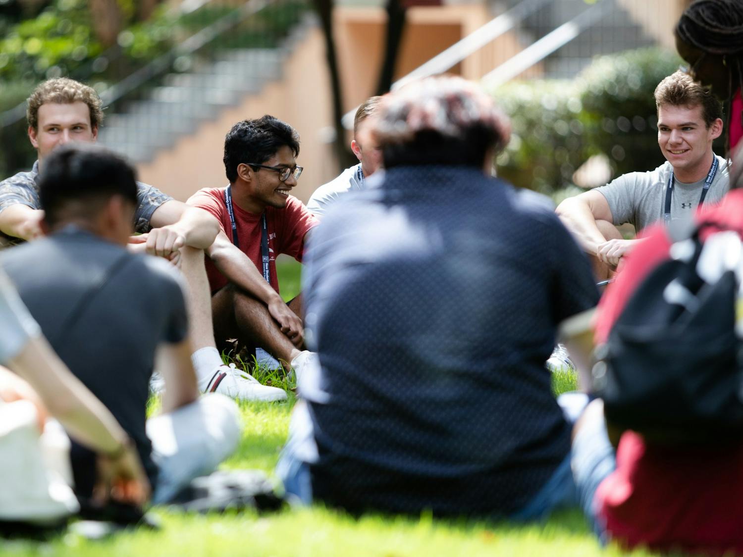 An incoming student laughs with people in his orientation group during a session on July 20, 2022. Students listened to presentations, toured campus and played games during orientation sessions held throughout the summer.
