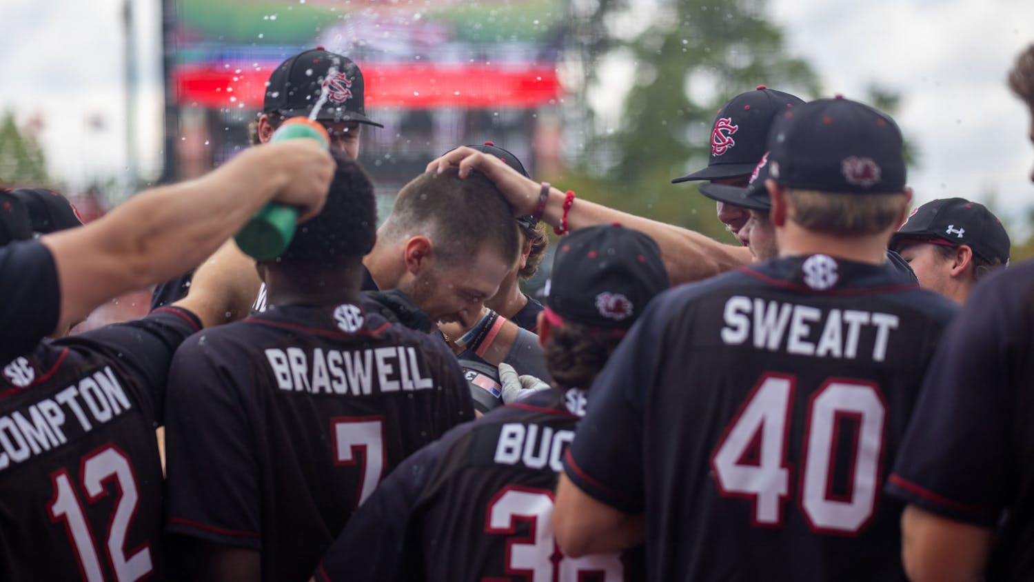 After opening the scoring with a first inning home run, senior infielder Braylen Wimmer gets congratulated by his teammates during the bottom of the first inning at Founders Park on April 22, 2023. Wimmer helped his team win the game against Florida 7-5.