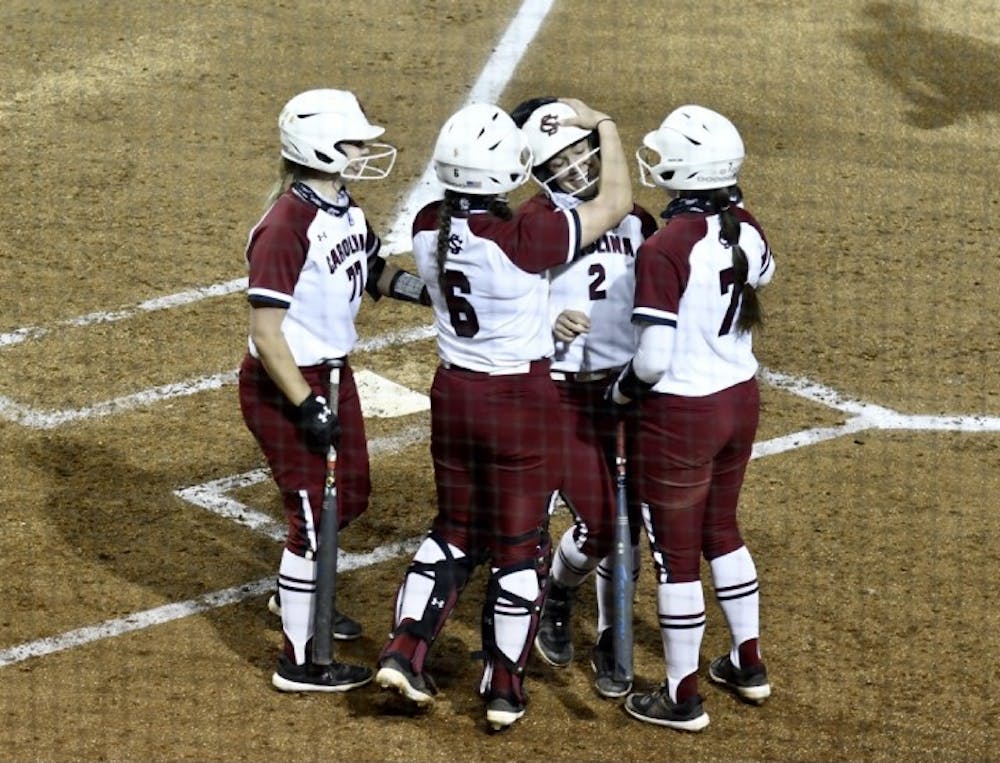 Graduate student shortstop Kenzi Maguire celebrates with teammates after hitting a home run in the second inning Wednesday. South Carolina beat Winthrop 10-1.