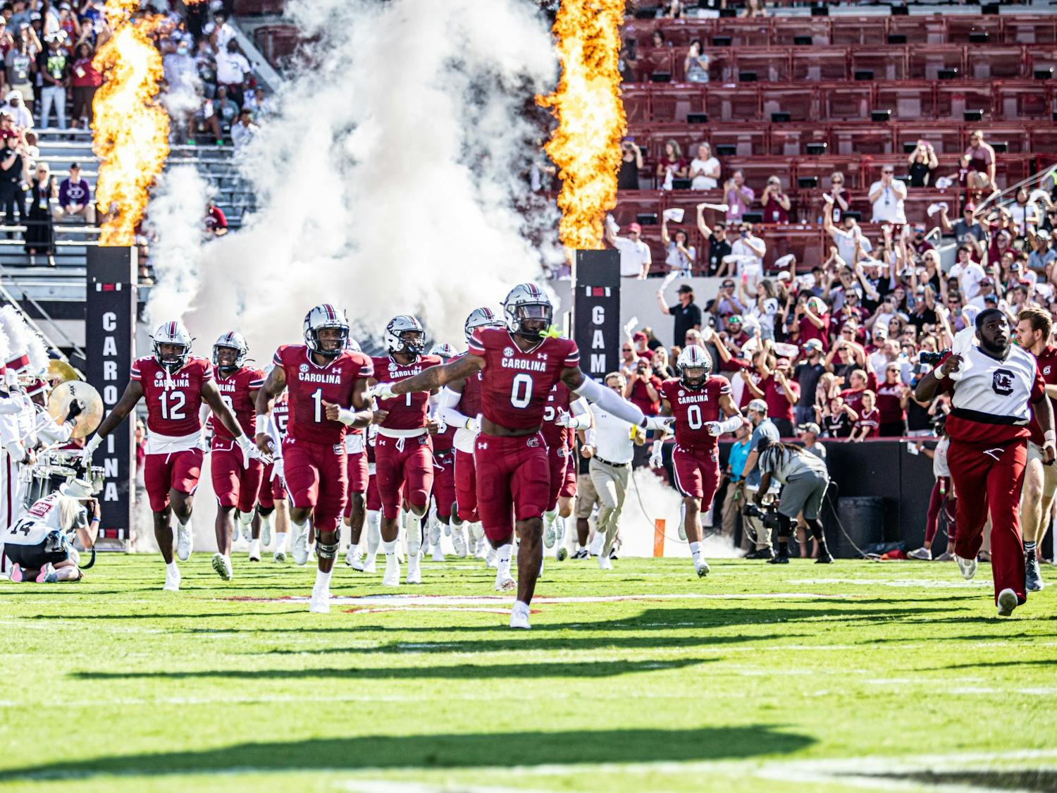 The Gamecock football team rushing the field for kick off at the Troy Football game Oct. 2, 2021, at Williams-Brice Stadium.&nbsp;