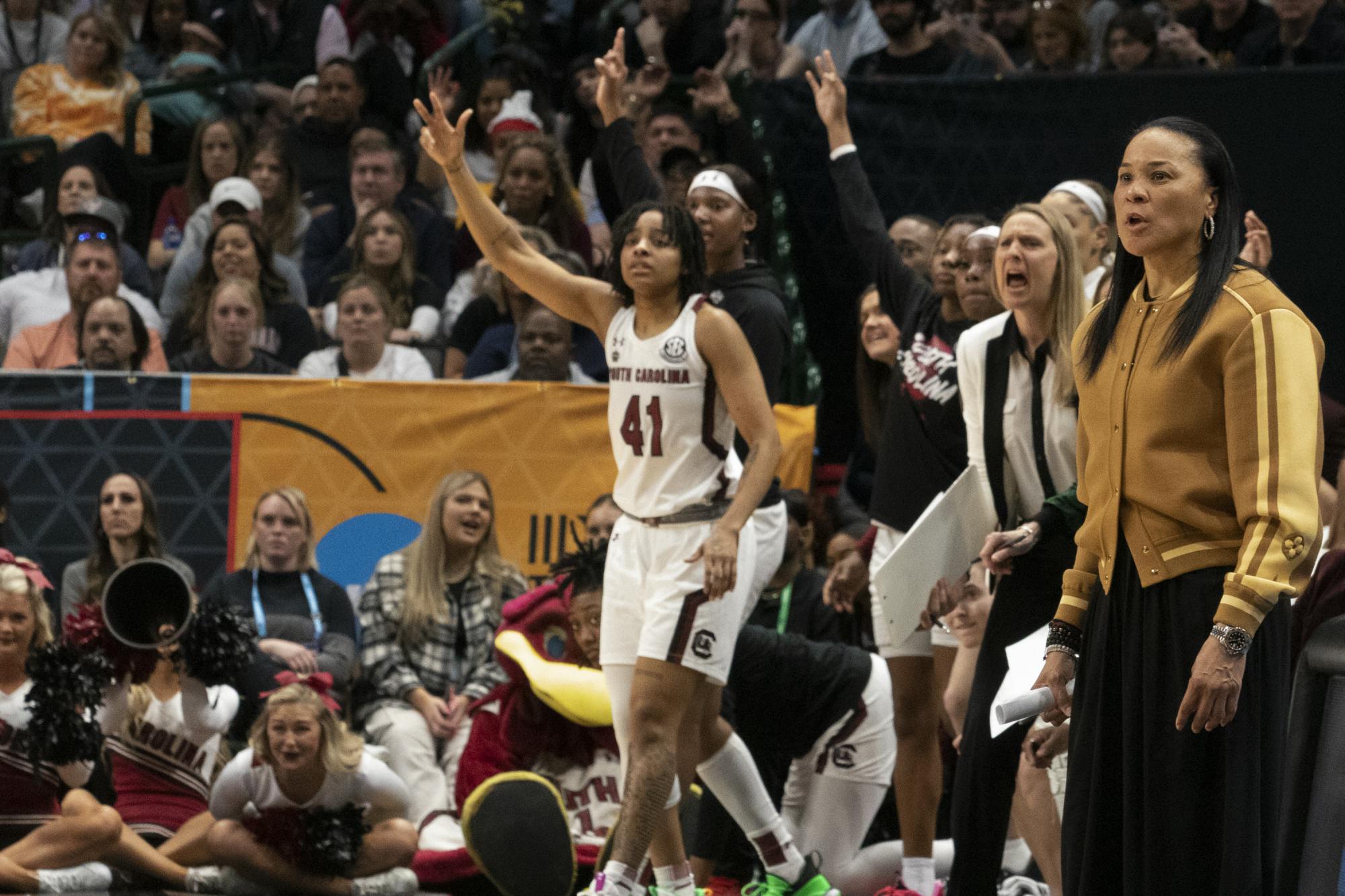 Head coach Dawn Staley and the rest of the Gamecock women’s basketball team rises as Johnson hits her first 3-pointer of the night against the University of Iowa at the Final Four match on March 31, 2023. Iowa led 59-55 at the end of the third quarter.&nbsp;