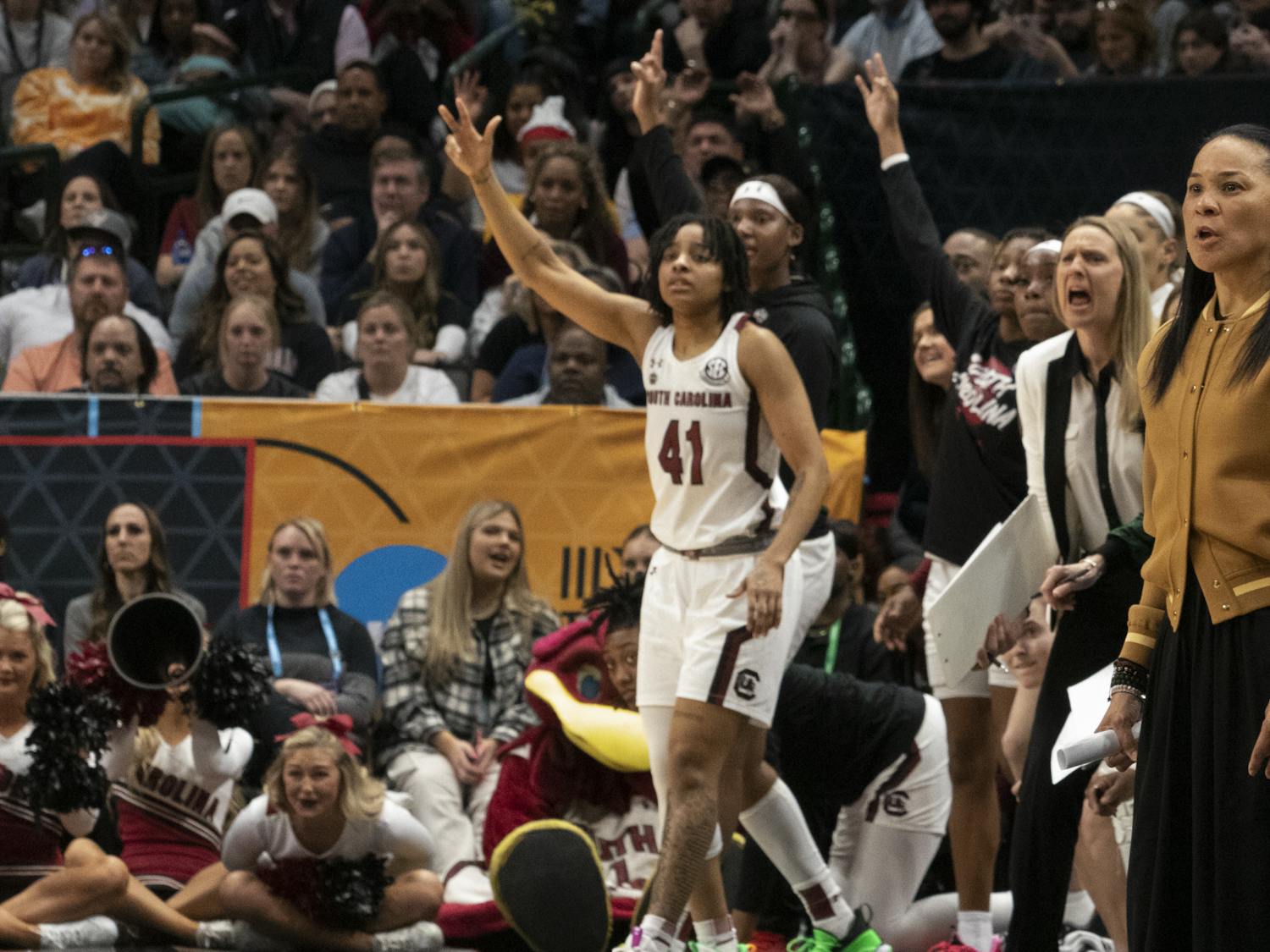 Head coach Dawn Staley and the rest of the Gamecock women’s basketball team rises as Johnson hits her first 3-pointer of the night against the University of Iowa at the Final Four match on March 31, 2023. Iowa led 59-55 at the end of the third quarter.&nbsp;