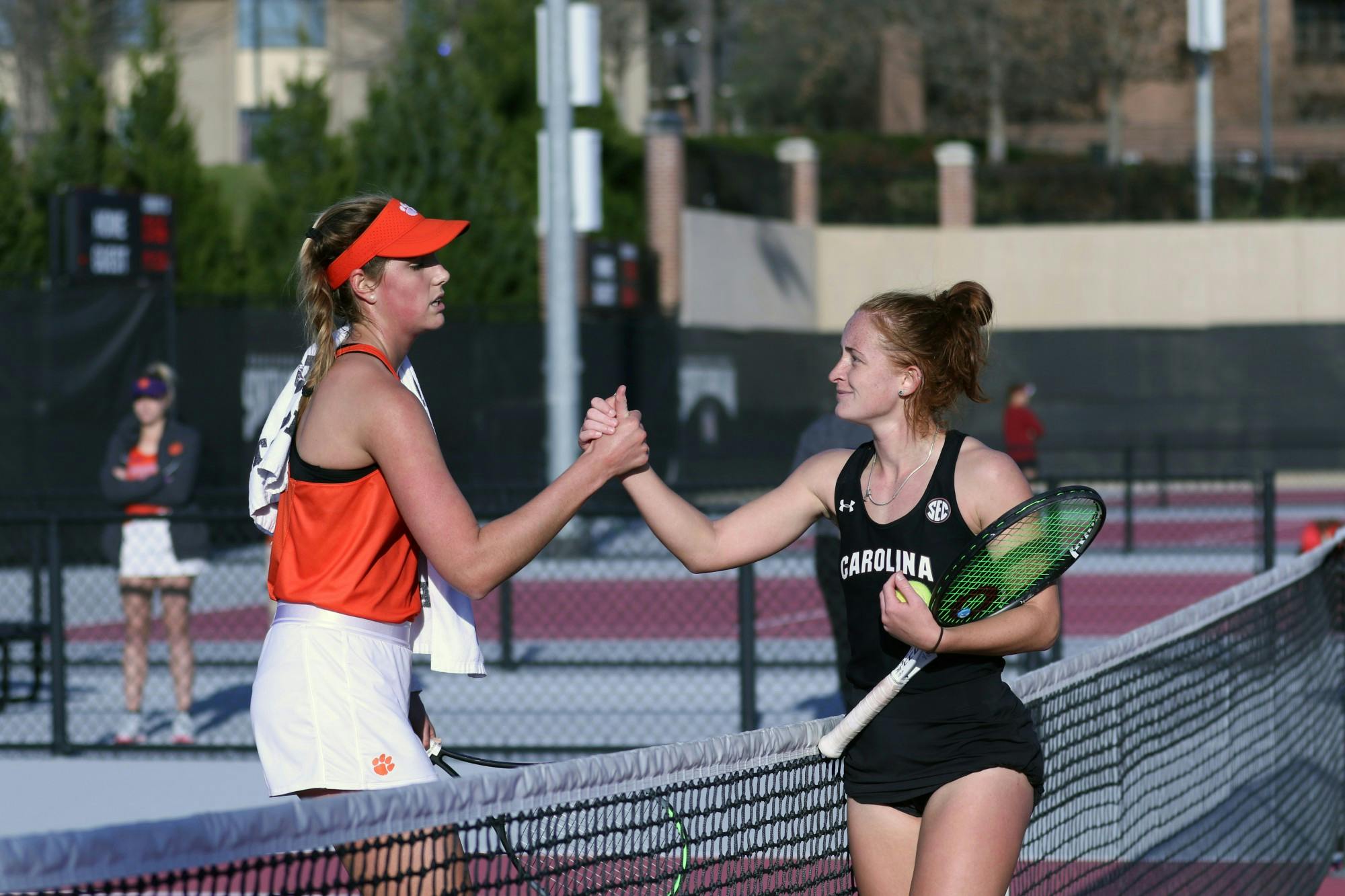 Gamecock junior Megan Davies shakes her opponent's hand after obtaining victory in straight sets. The rest of the Gamecocks followed suit, and overall the Gamecock women's tennis team defeated Clemson 6-1.