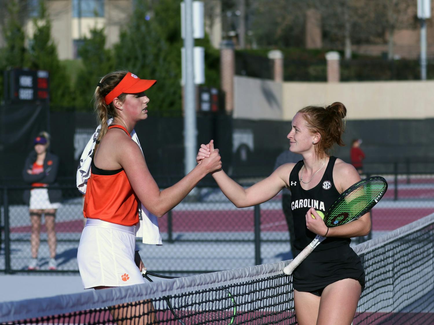 Gamecock junior Megan Davies shakes her opponent's hand after obtaining victory in straight sets. The rest of the Gamecocks followed suit, and overall the Gamecock women's tennis team defeated Clemson 6-1.