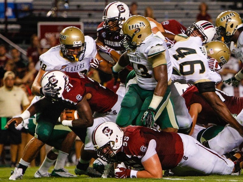 Lattimore (21) became South Carolina’s all-time leader in career touchdowns Saturday night, breaking George Rogers and Harold Green's record with 34.